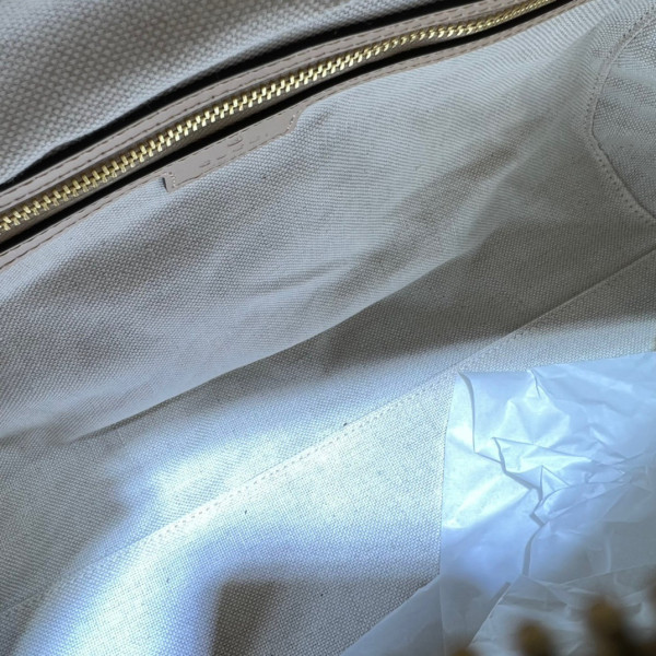 G*u*i gg matelassé leather top handle bag