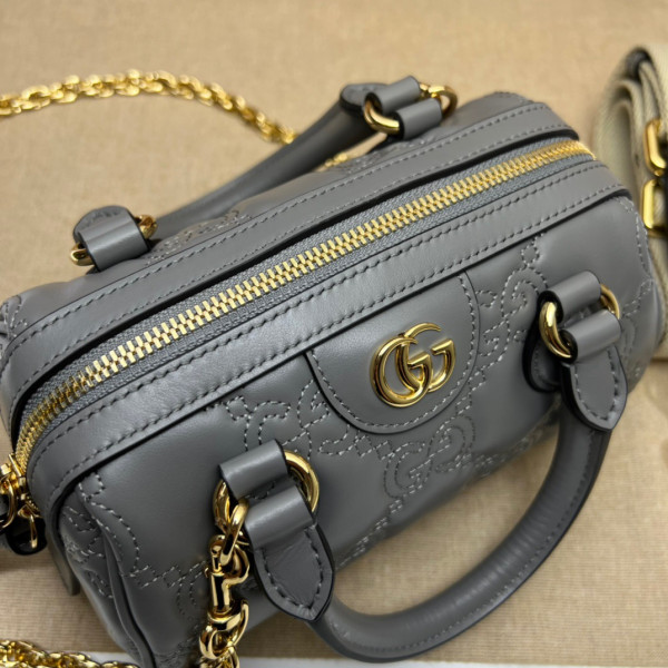 G*u*i gg matelassé leather top handle bag